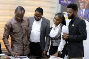 Pinnacle Gate researchers reviewing survey data with a client in Accra